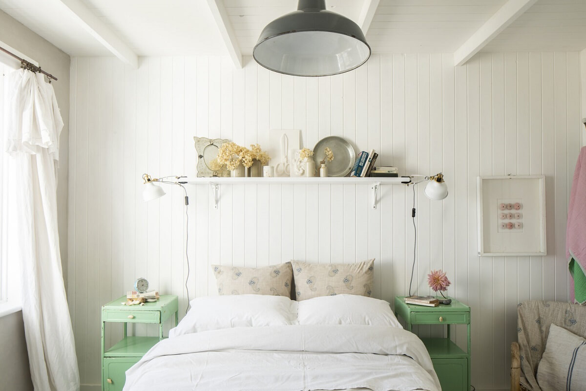 A Bright Coastal Home with Blue Color Accents in England 11 white-bedroom-green-nightstands-nordroom