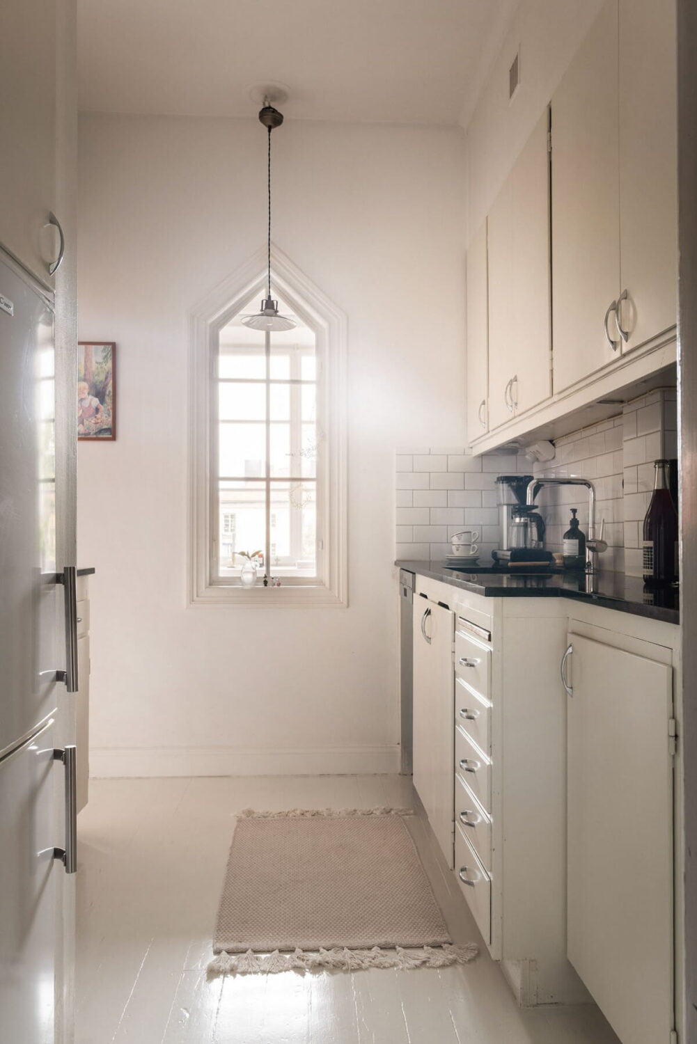 A Lovely Swedish Apartment with William Morris Bedroom 14 white-kitchen-with-indoor-window-nordroom