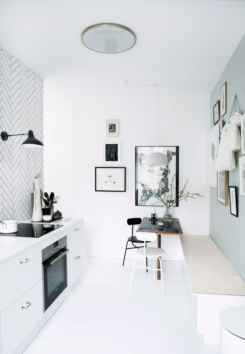 Sherwin-Williams Color of the Year 2024: Upward 23 white-kitchen-with-light-blue-accent-wall-nordroom