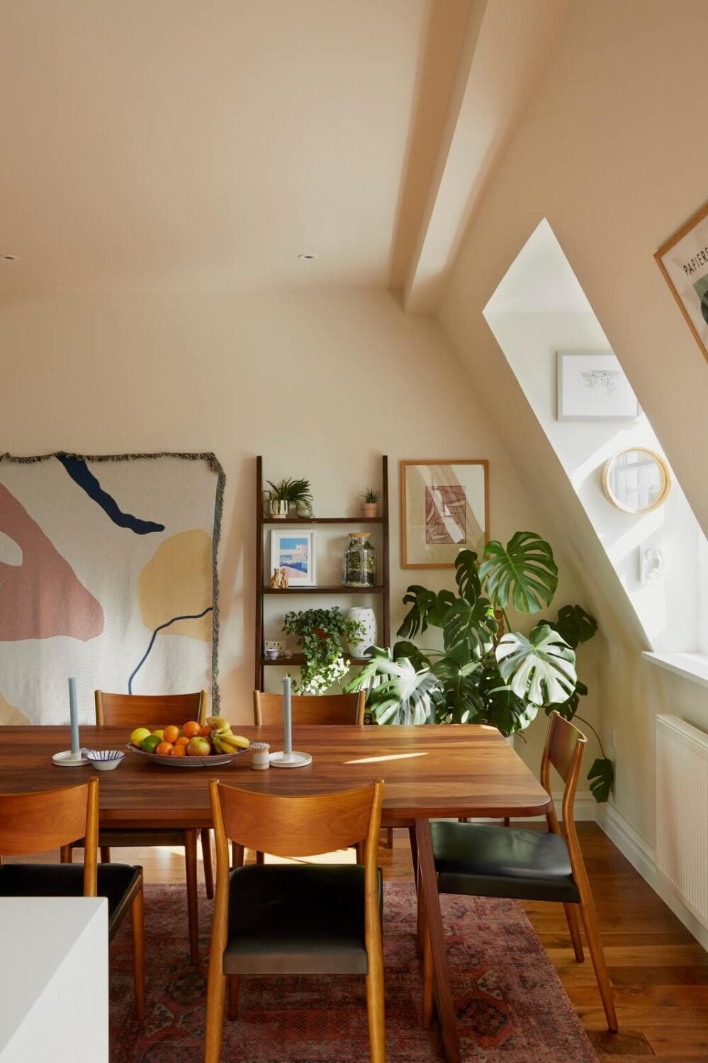 A Light Attic Apartment in London 7 wooden-dining-table-slanted-ceiling-attic-apartment-nordroom