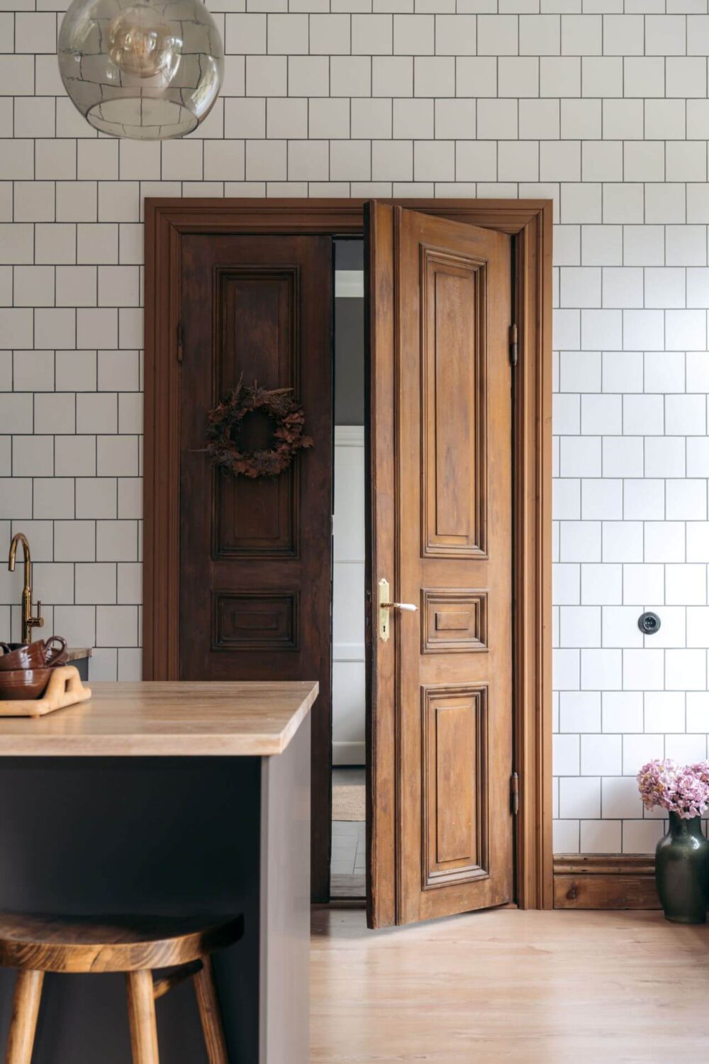A Former Swedish School is Now a Beautiful Home 2 wooden-double-doors-kitchen-nordroom