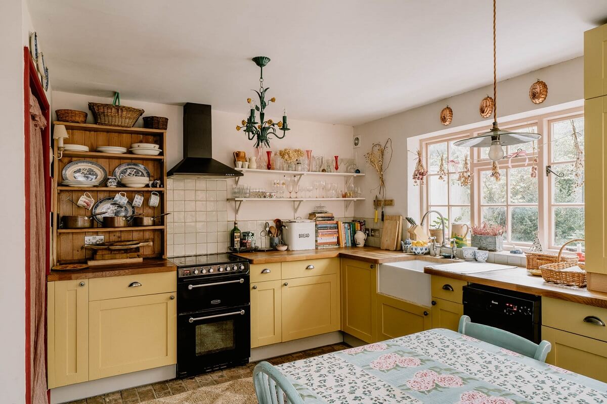 A Charming English Cottage with Color Accents 9 yellow-cottage-kitchen-butler-sink-window-nordroom