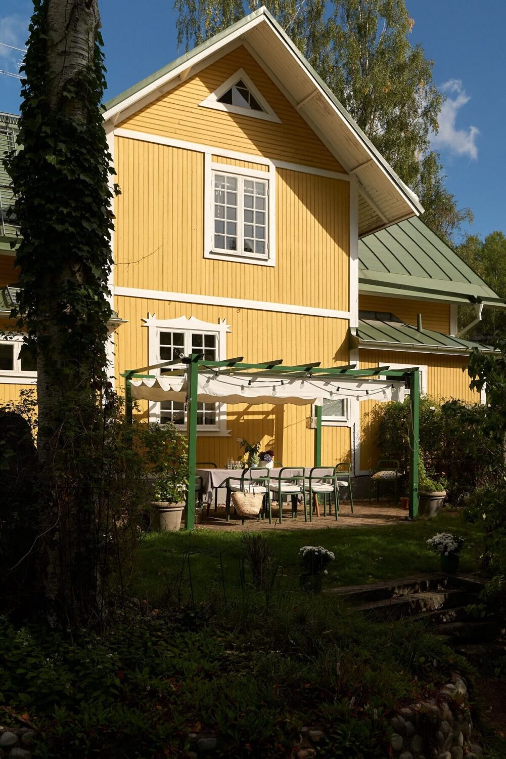 10 Easy Budget-Friendly Upgrades To Boost Your Home's Appeal 16 yellow-exterior-garden-dining-area-nordroom