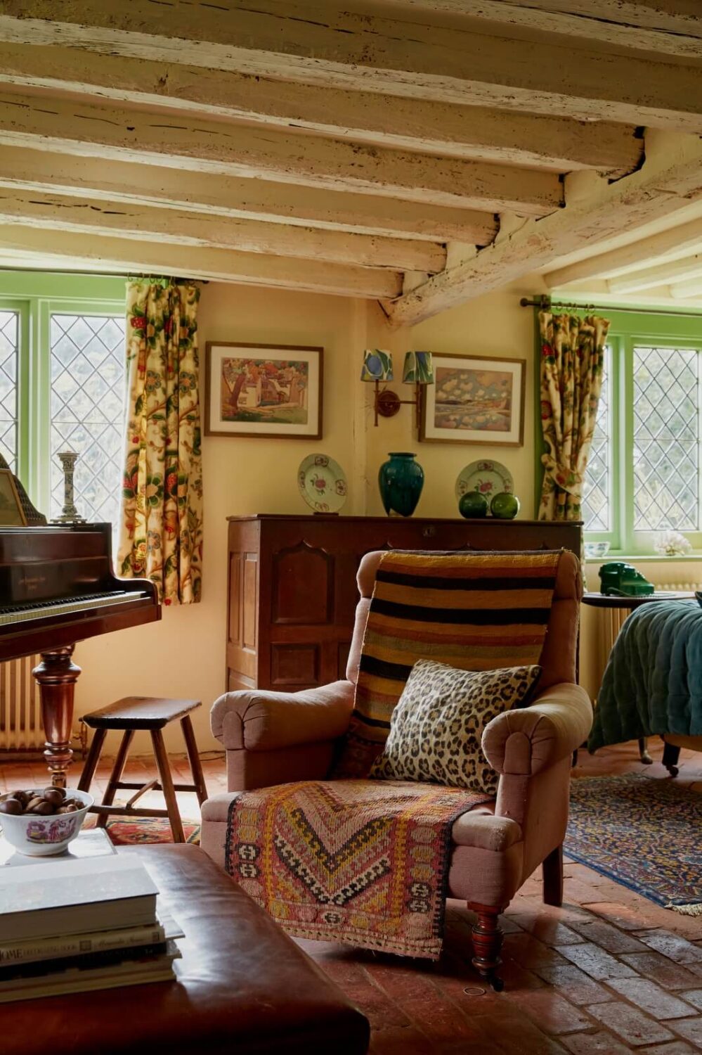 A Charming Historic Farmhouse with a Bright Yellow Kitchen 4 armchair cottage living room exposed beams