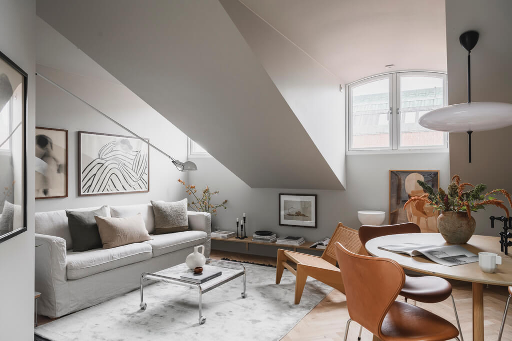 A Stylish Modern Gray Attic Apartment 1 attic-apartment-open-plan-living-room-round-dining-table-nordroom