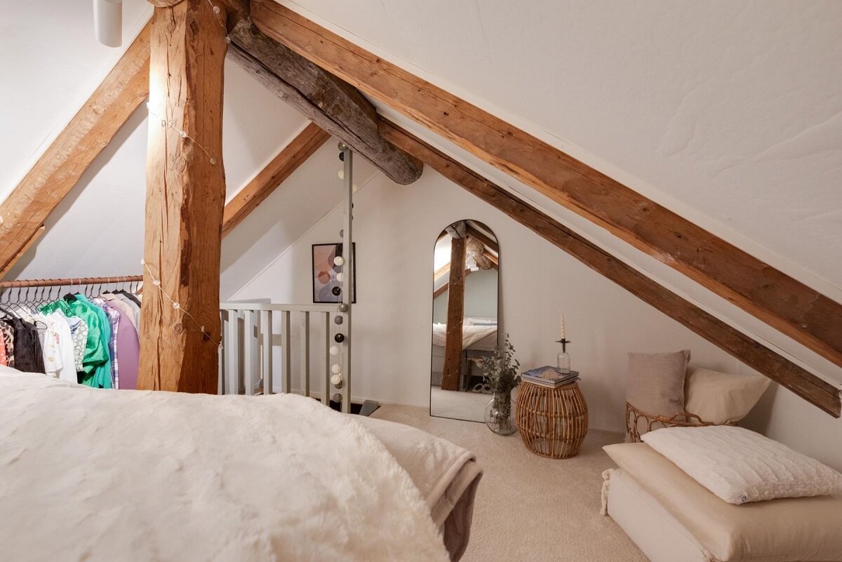 A Small 18th-Century Courtyard House in Sweden 16 attic bedroom slanted ceilings wooden beams