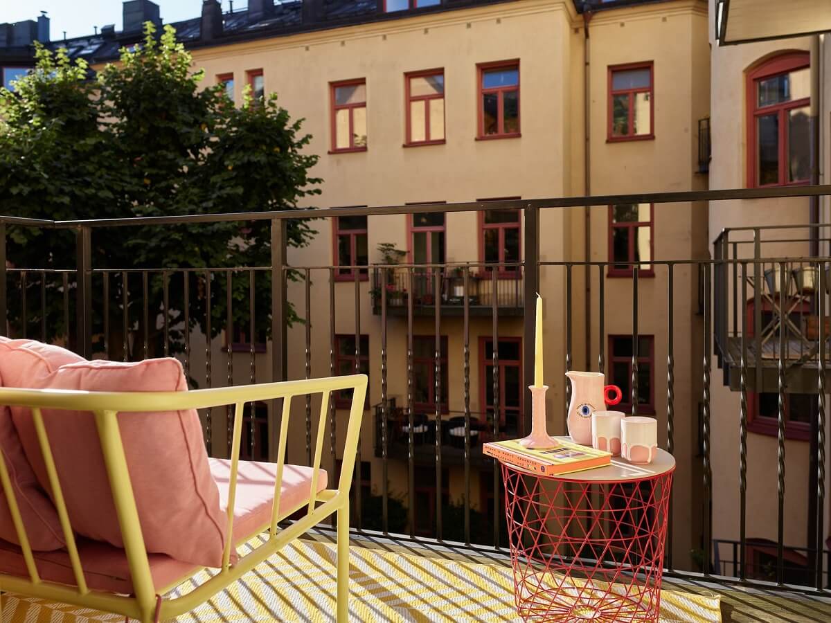 A Small Stockholm Apartment Filled with Color 17 balcony-overlooking-courtyard