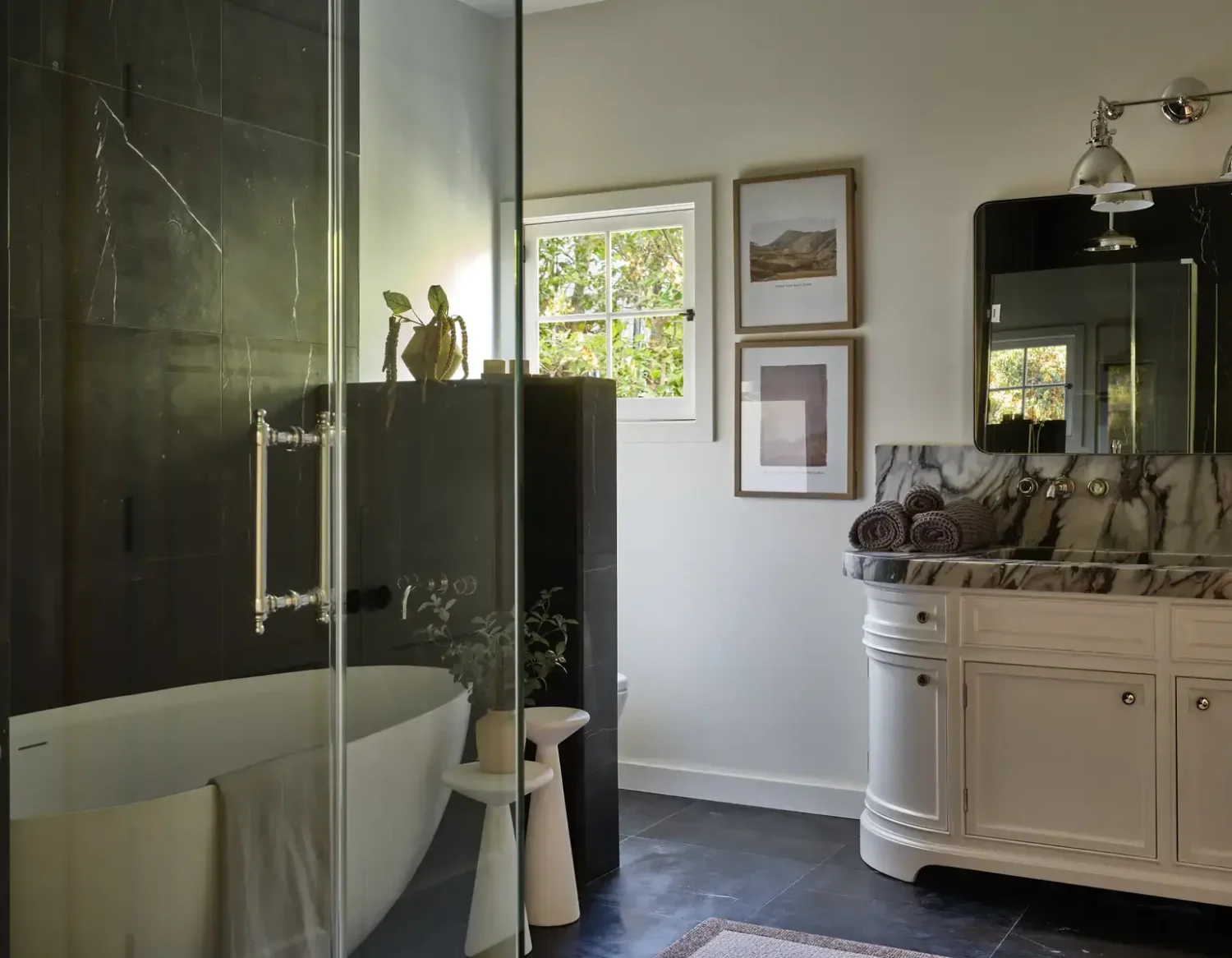 A Renovated Spanish Style Home in Hollywood Hills 32 bathroom-black-tiles-freestanding-bath-nordroom