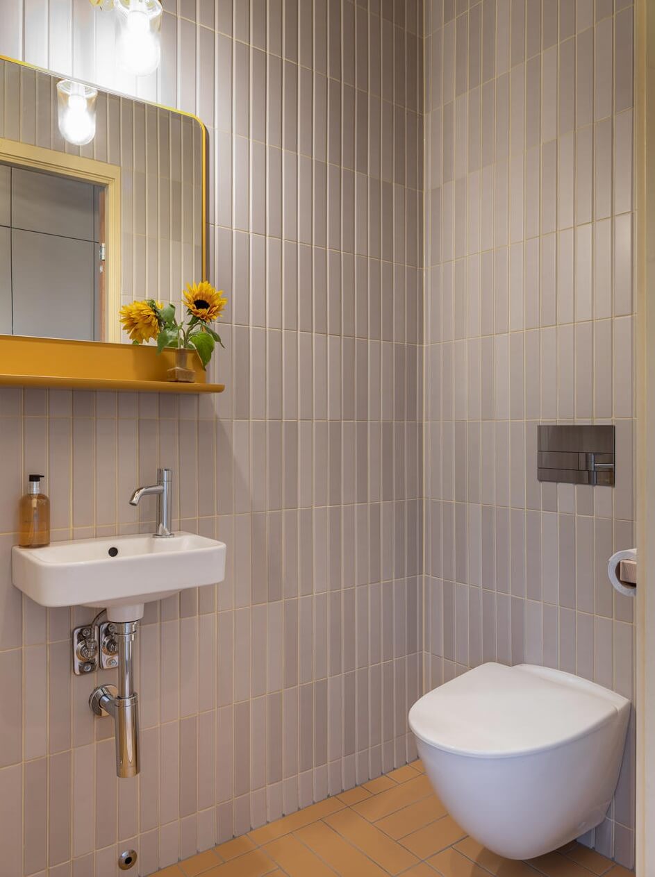 An Architectural Wooden Home with Open Spaces 21 bathroom-yellow-mirror-nordroom