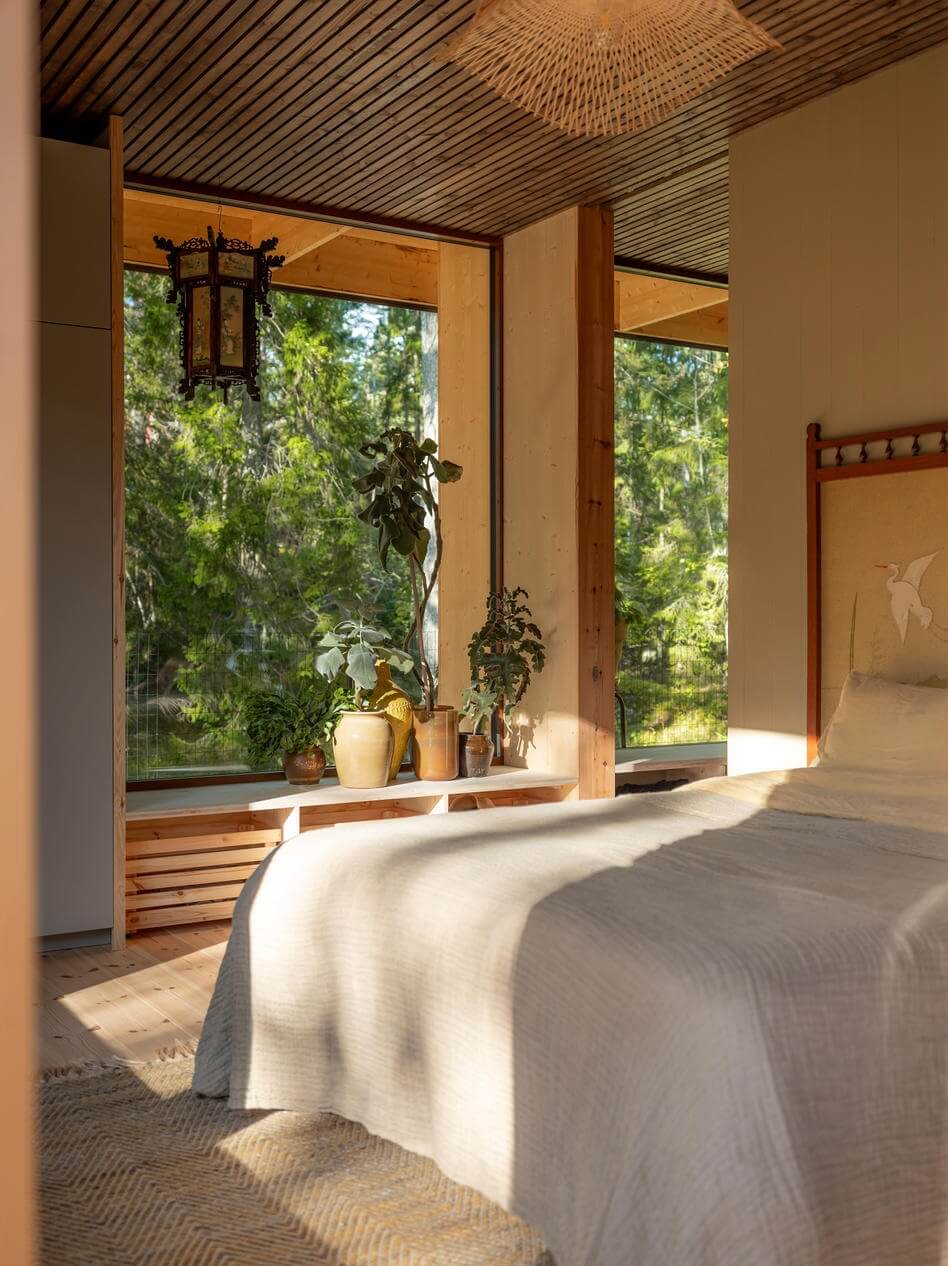 An Architectural Wooden Home with Open Spaces 16 bedroom-large-window-natural-light-wooden-accent-wall-nordroom