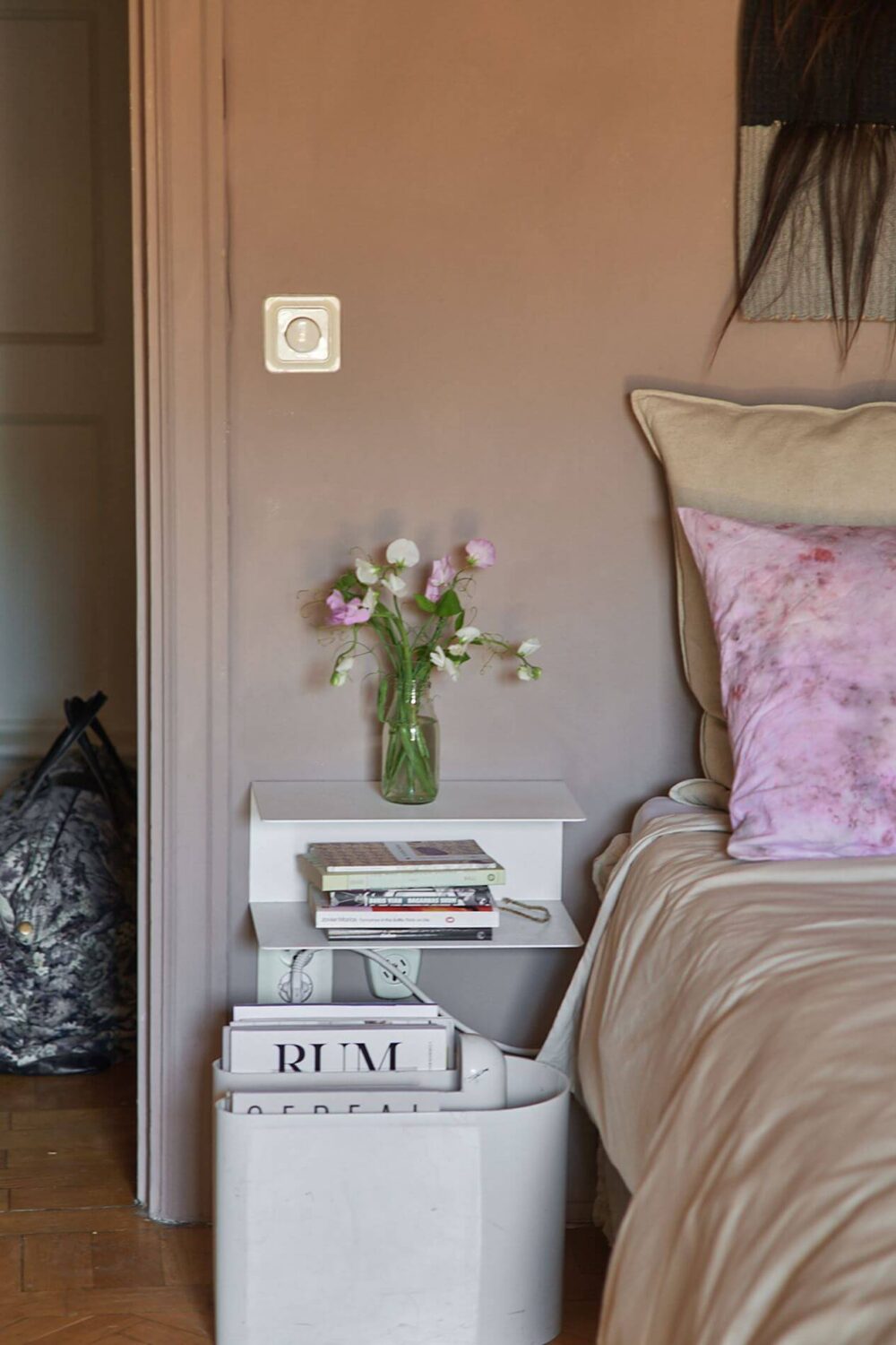 A Scandinavian Studio Apartment with Pink Walls 7 bedroom-nightstand