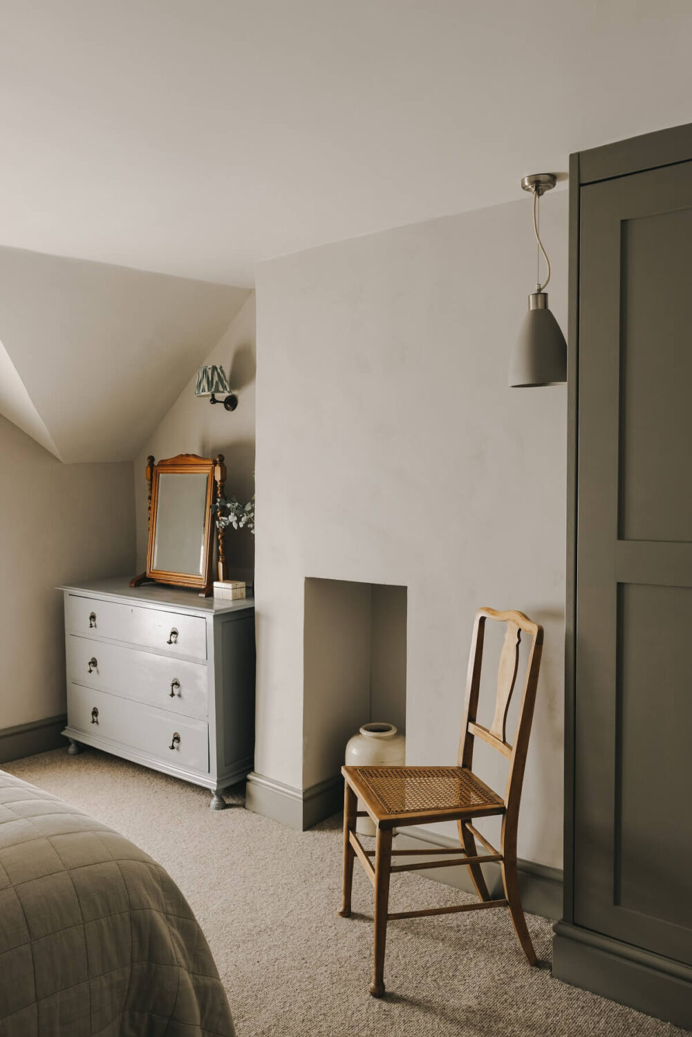 The Workers Cottage: An English Holiday Home with a Royal Past 12 bedroom-slanted-ceiling-gray-accents