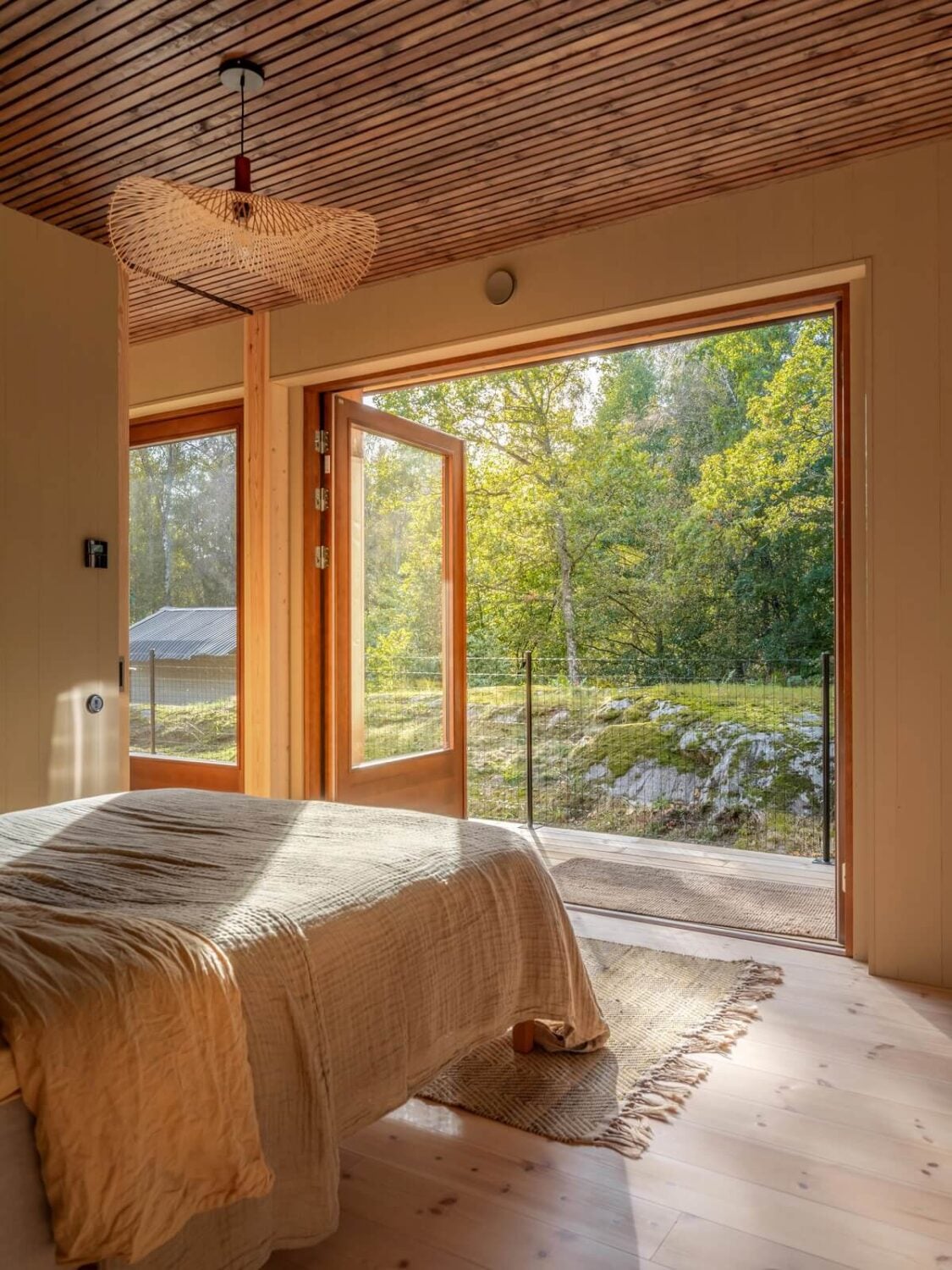 An Architectural Wooden Home with Open Spaces 17 bedroom-terrace-wooden-ceiling-nordroom