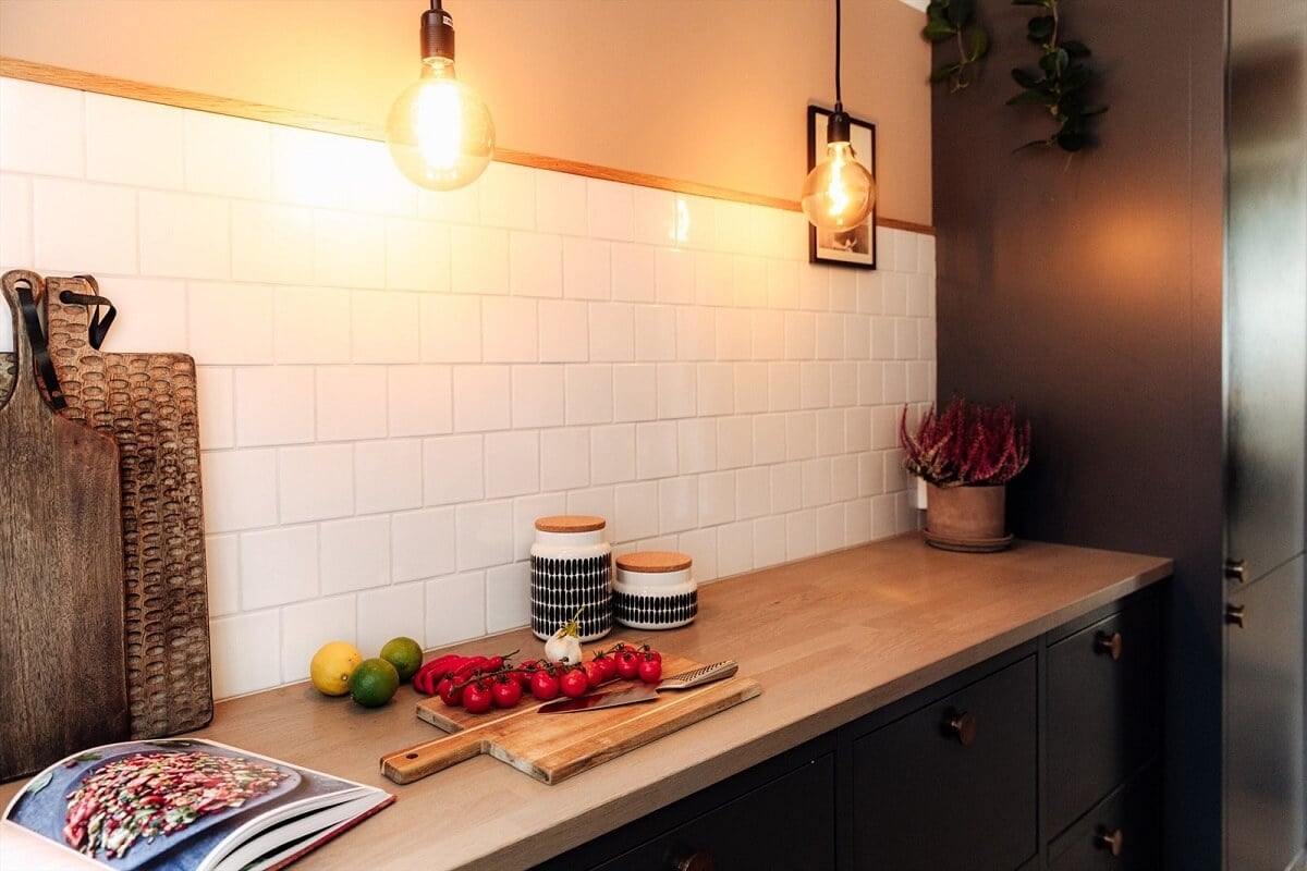 A Charming Norwegian Apartment with Wooden Walls 10 black-kitchen-wooden-worktop-white-tiles