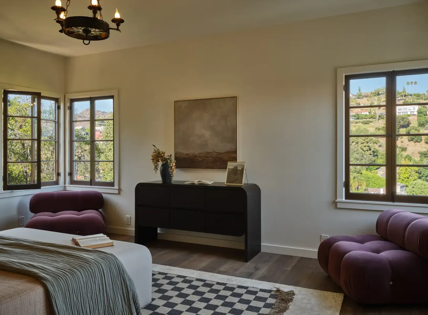 A Renovated Spanish Style Home in Hollywood Hills 25 checkerboard-rug-bedroom-purple-armchairs-nordroom