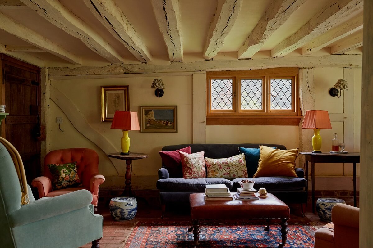 A Charming Historic Farmhouse with a Bright Yellow Kitchen 2 cottage living room low ceiling