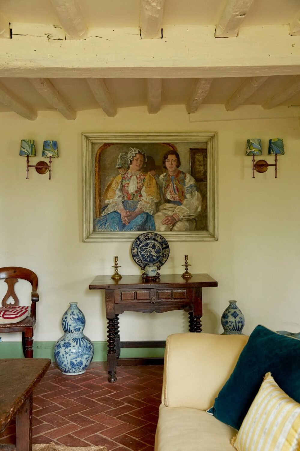 A Charming Historic Farmhouse with a Bright Yellow Kitchen 6 cottage sitting room stone floor