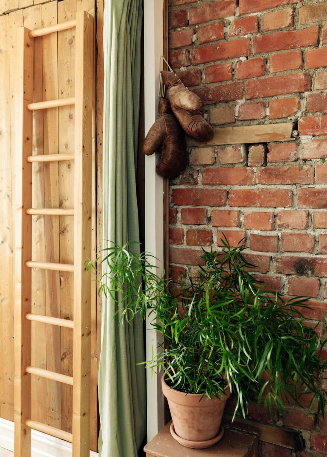 A Charming Norwegian Apartment with Wooden Walls 18 exposed-brick-wall-green-curtain