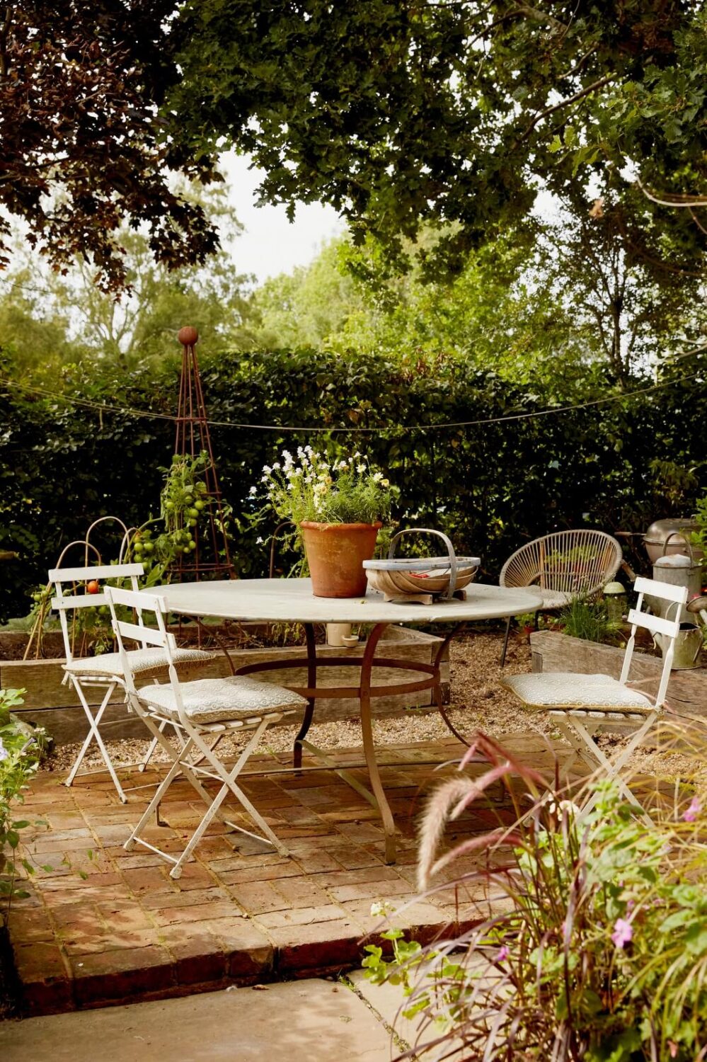 A Charming Historic Farmhouse with a Bright Yellow Kitchen 20 garden dining space