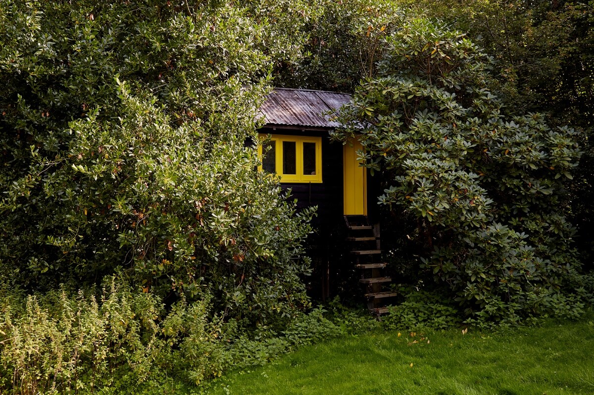 A Charming Historic Farmhouse with a Bright Yellow Kitchen 25 garden shed