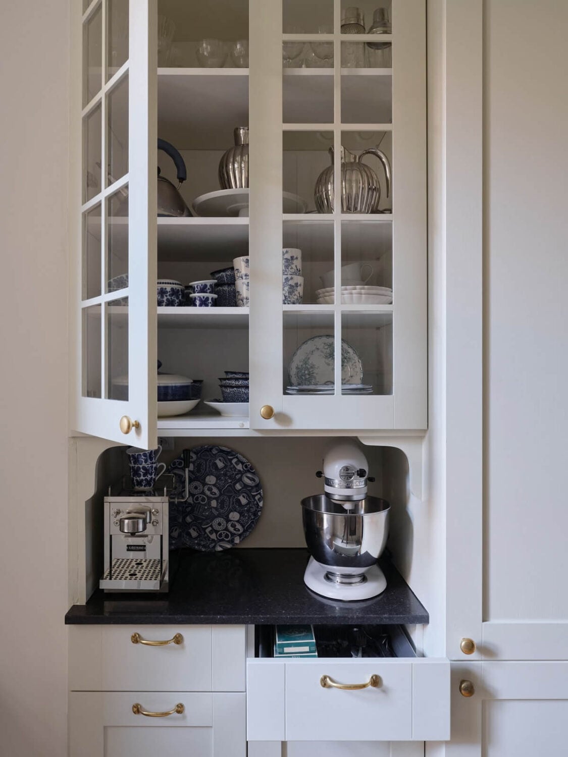 A Light Scandinavian Apartment with Classic Touches 20 glass-kitchen-cabinets-nordroom
