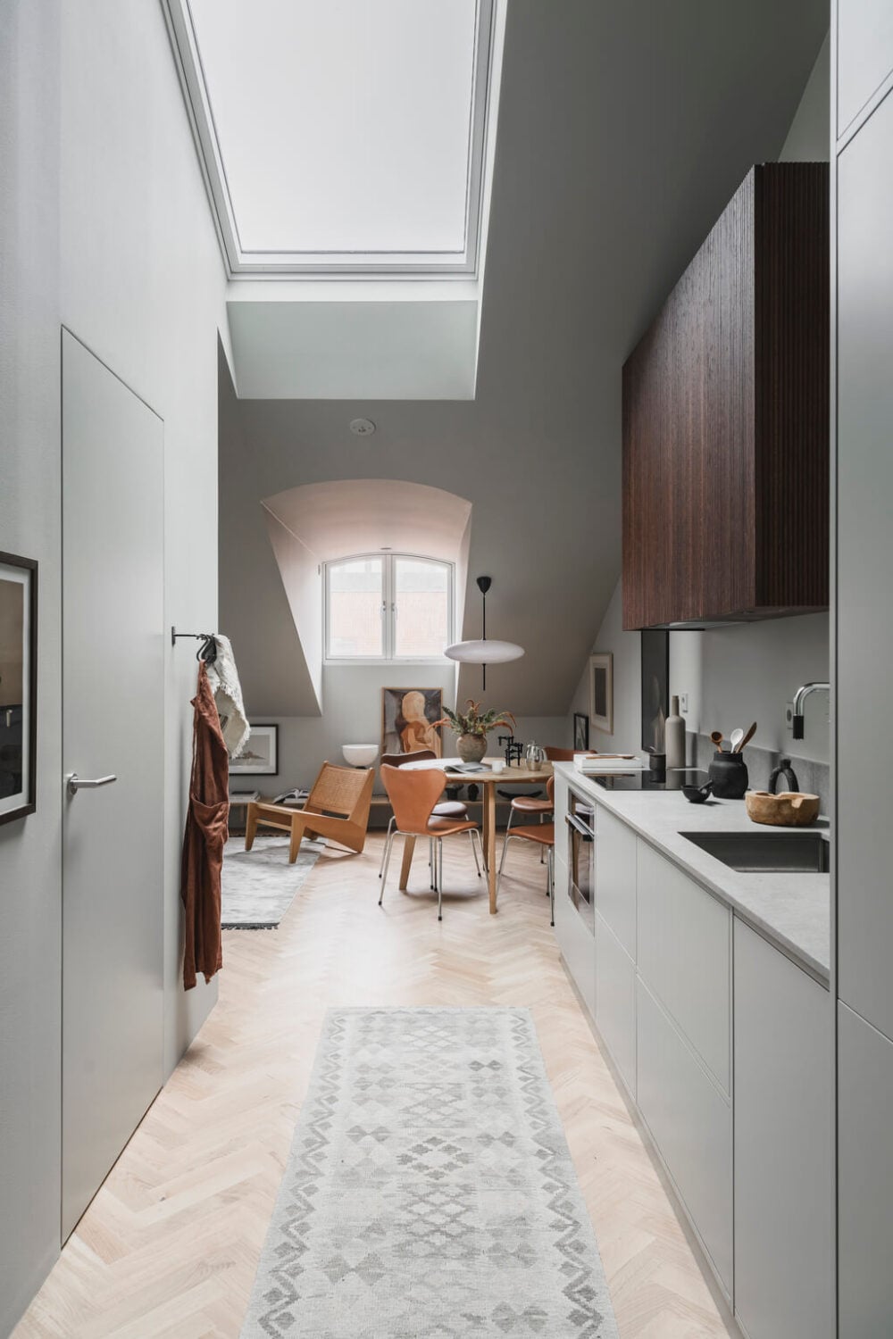 A Stylish Modern Gray Attic Apartment 11 gray-attic-apartment-modern-kitchen-skylight-nordroom