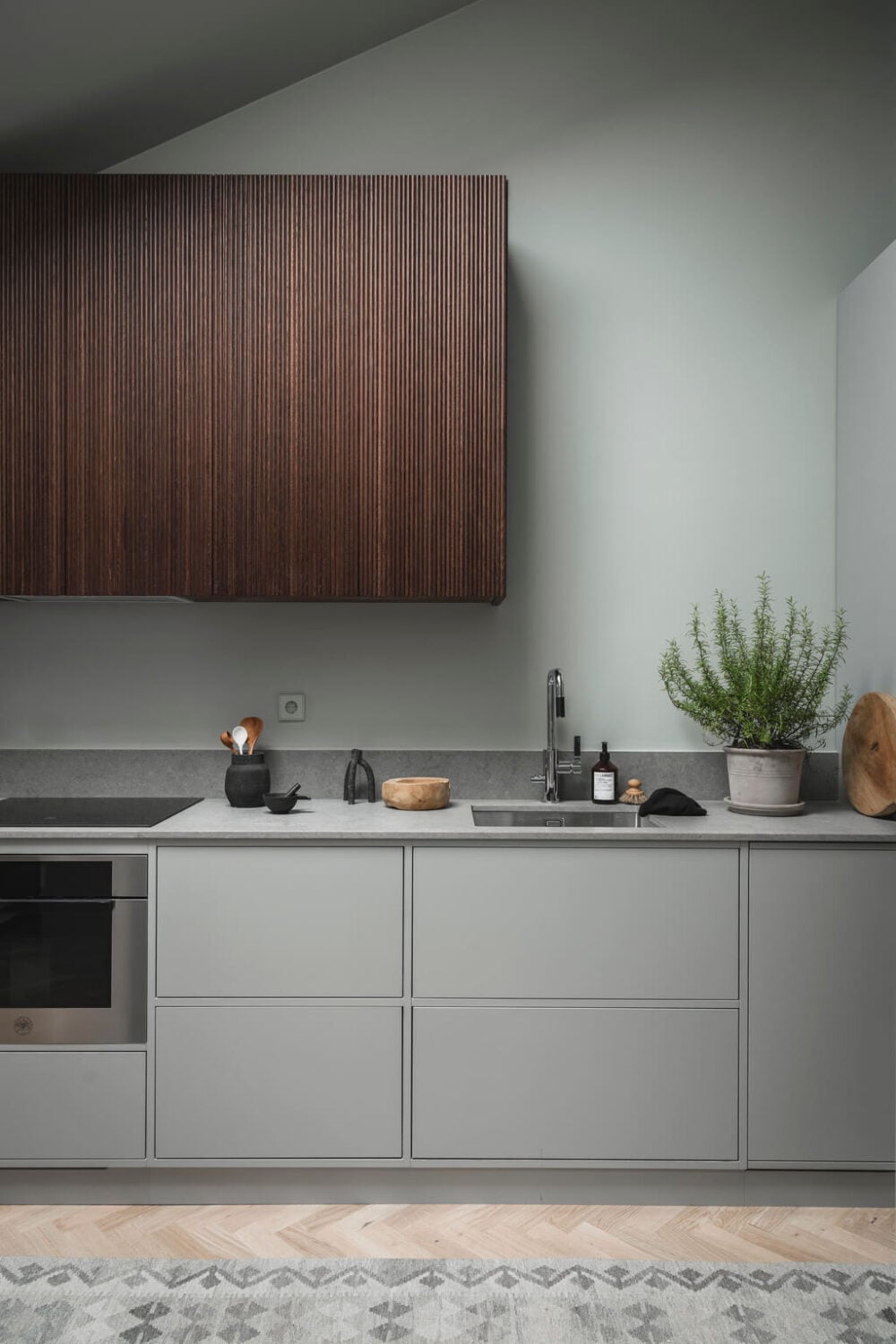 A Stylish Modern Gray Attic Apartment 9 gray-wood-scandinavian-kitchen