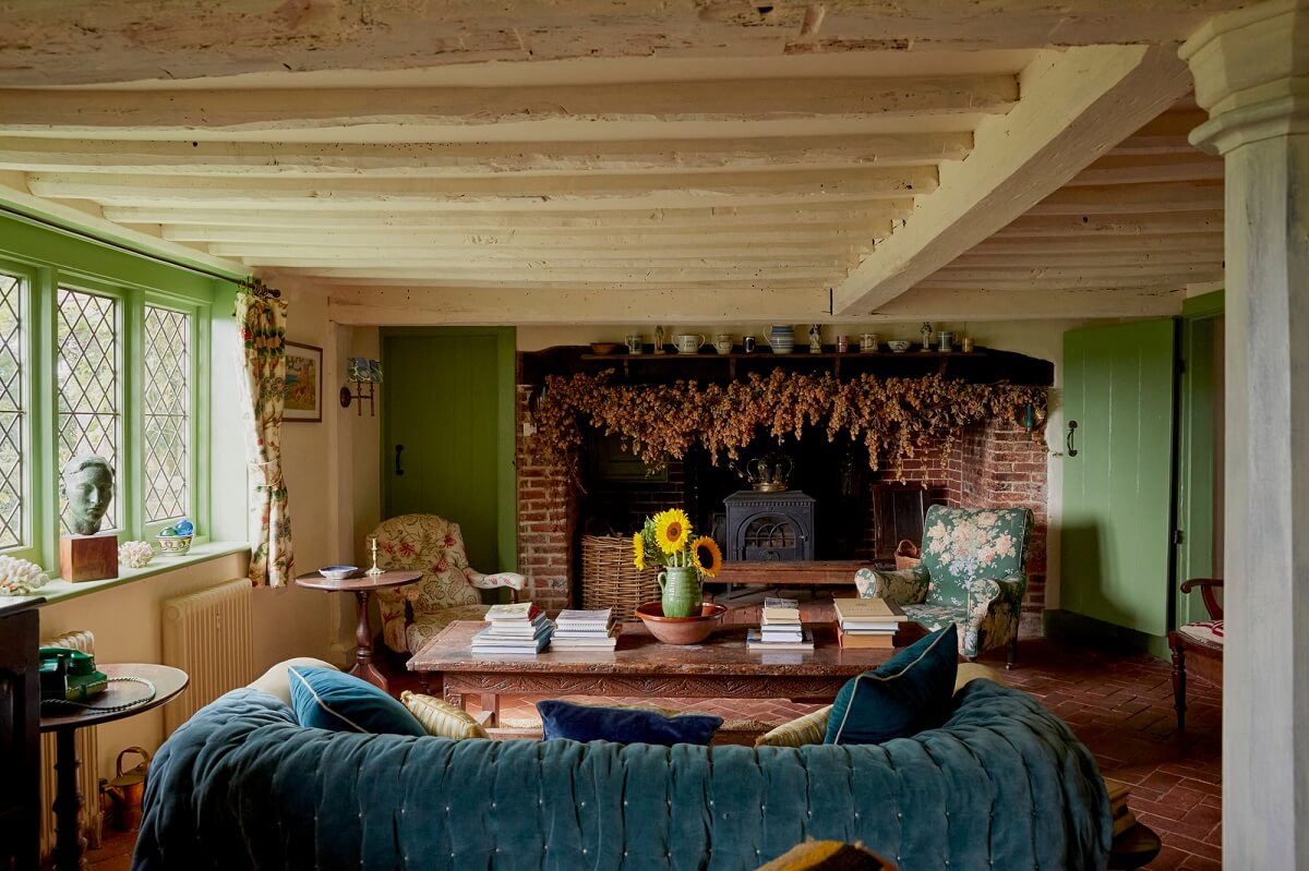 A Charming Historic Farmhouse with a Bright Yellow Kitchen 1 green cottage living room green walls