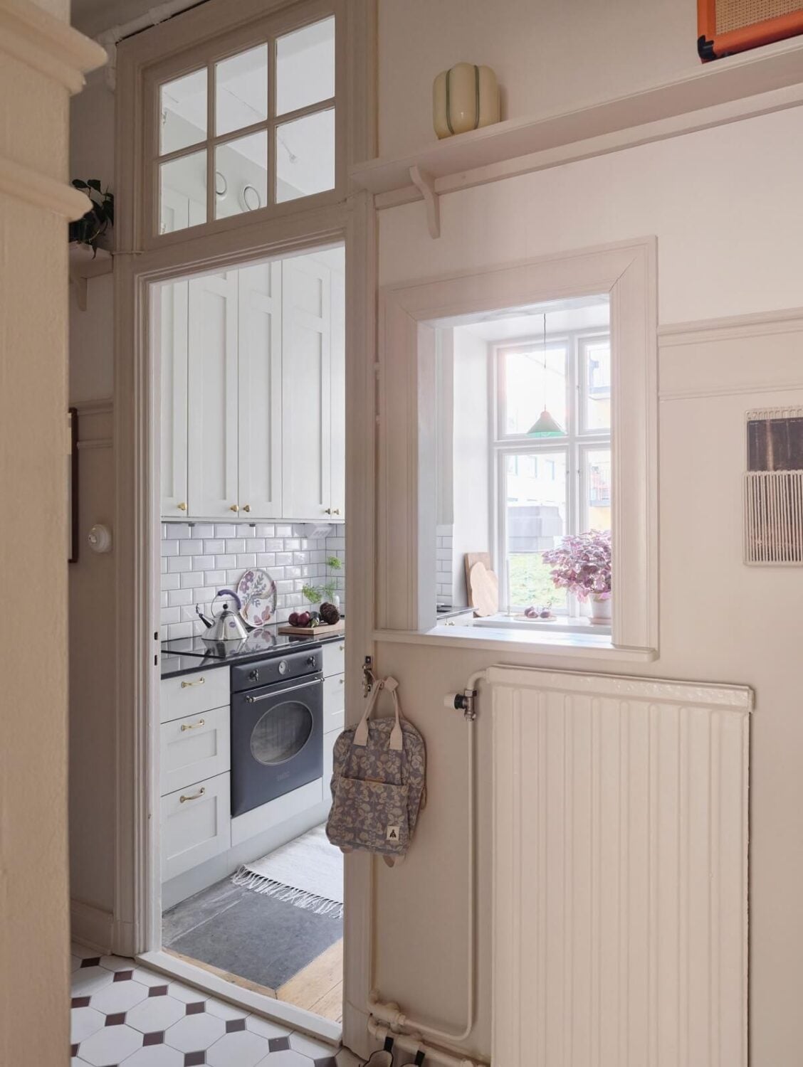A Light Scandinavian Apartment with Classic Touches 22 hallway-tile-floor