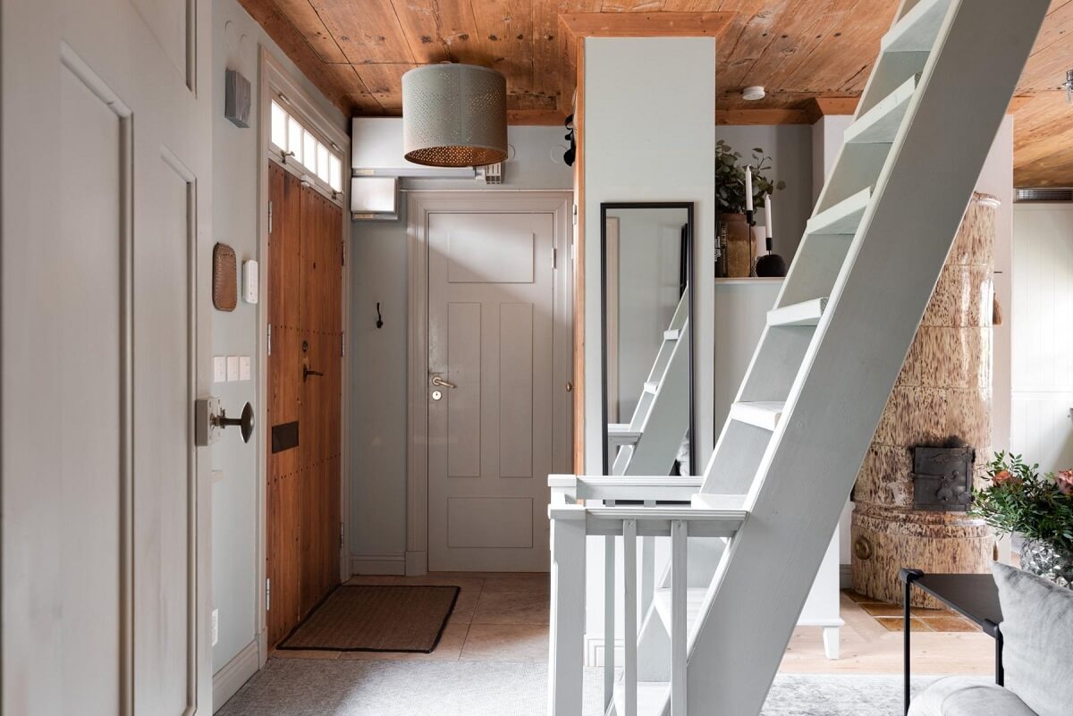A Small 18th-Century Courtyard House in Sweden 14 hallway tiny swedish house wooden ceiling