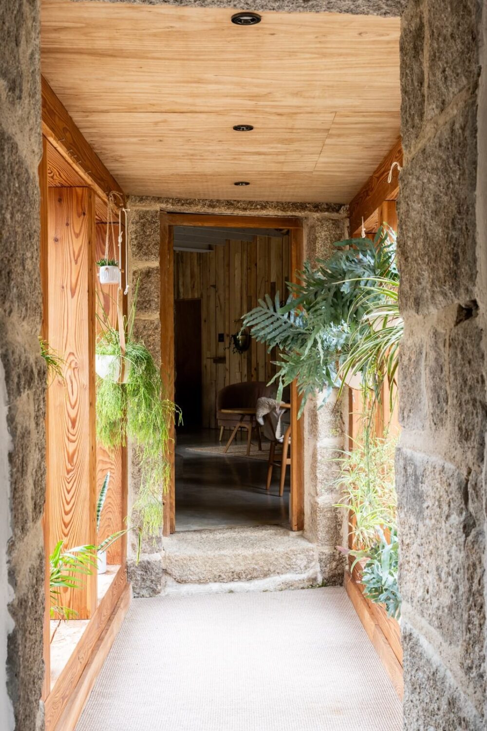 An English Country House That Pairs History with Contemporary Design 9 hallway-wood-stone-plants-grand-designs-nordroom