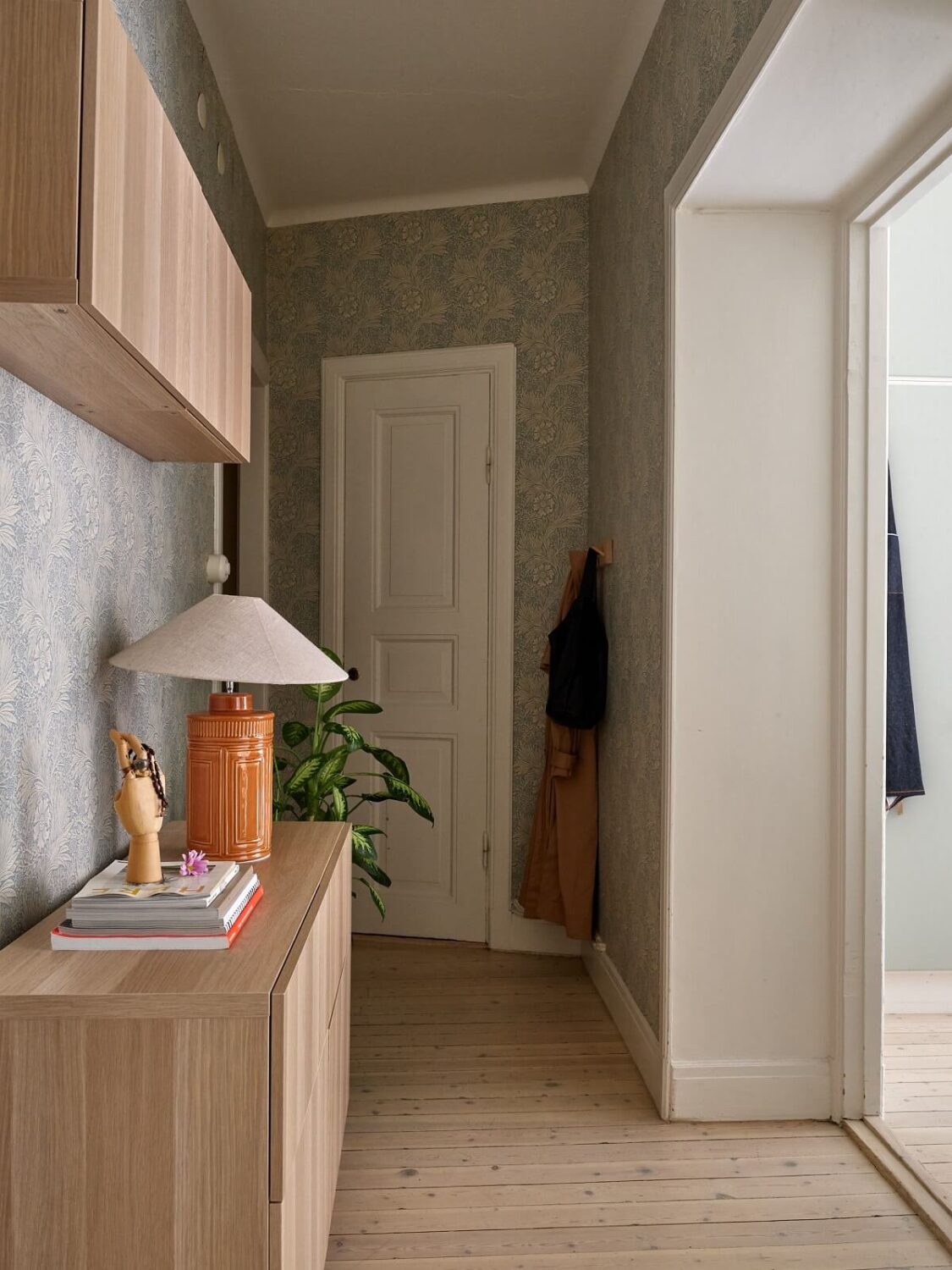 Pastel Colors in a Light Scandinavian Apartment 17 hallway-wooden-floor-wallpaper-nordroom