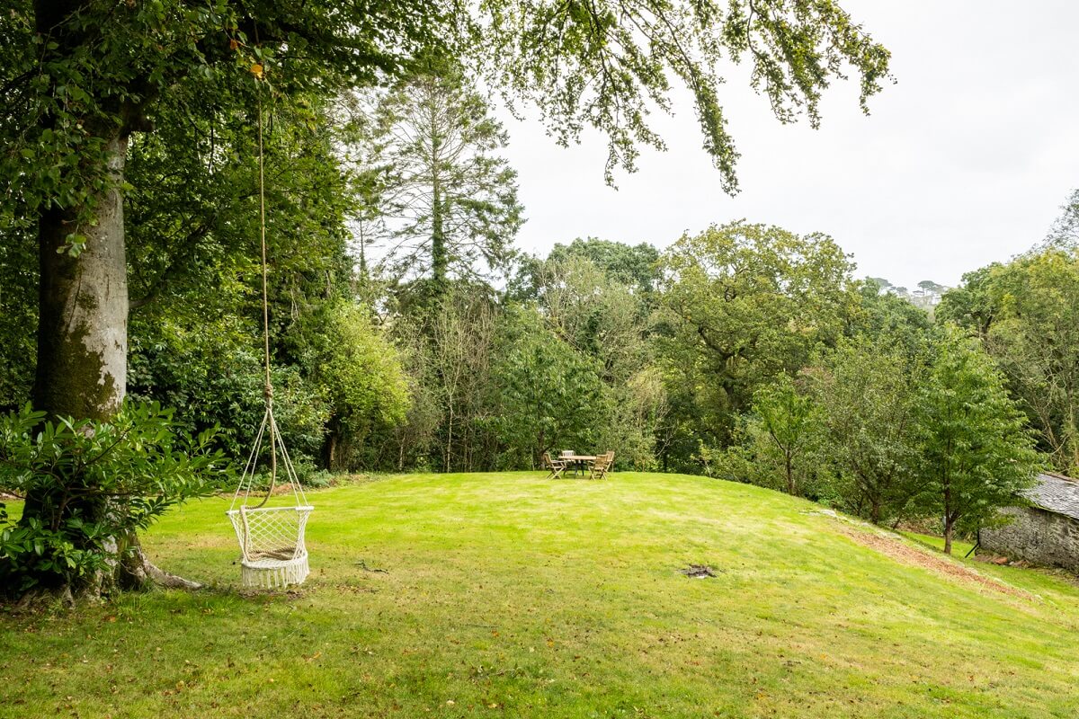 An English Country House That Pairs History with Contemporary Design 21 hilly-garden-tree-swing-nordroom