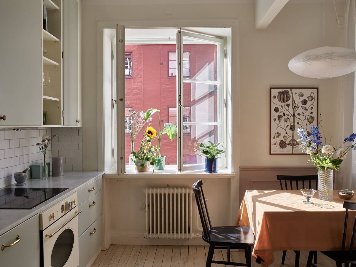 Pastel Colors in a Light Scandinavian Apartment 9 kitchen-dining-area