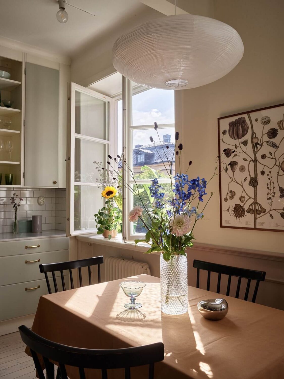 Pastel Colors in a Light Scandinavian Apartment 8 kitchen-dining-table