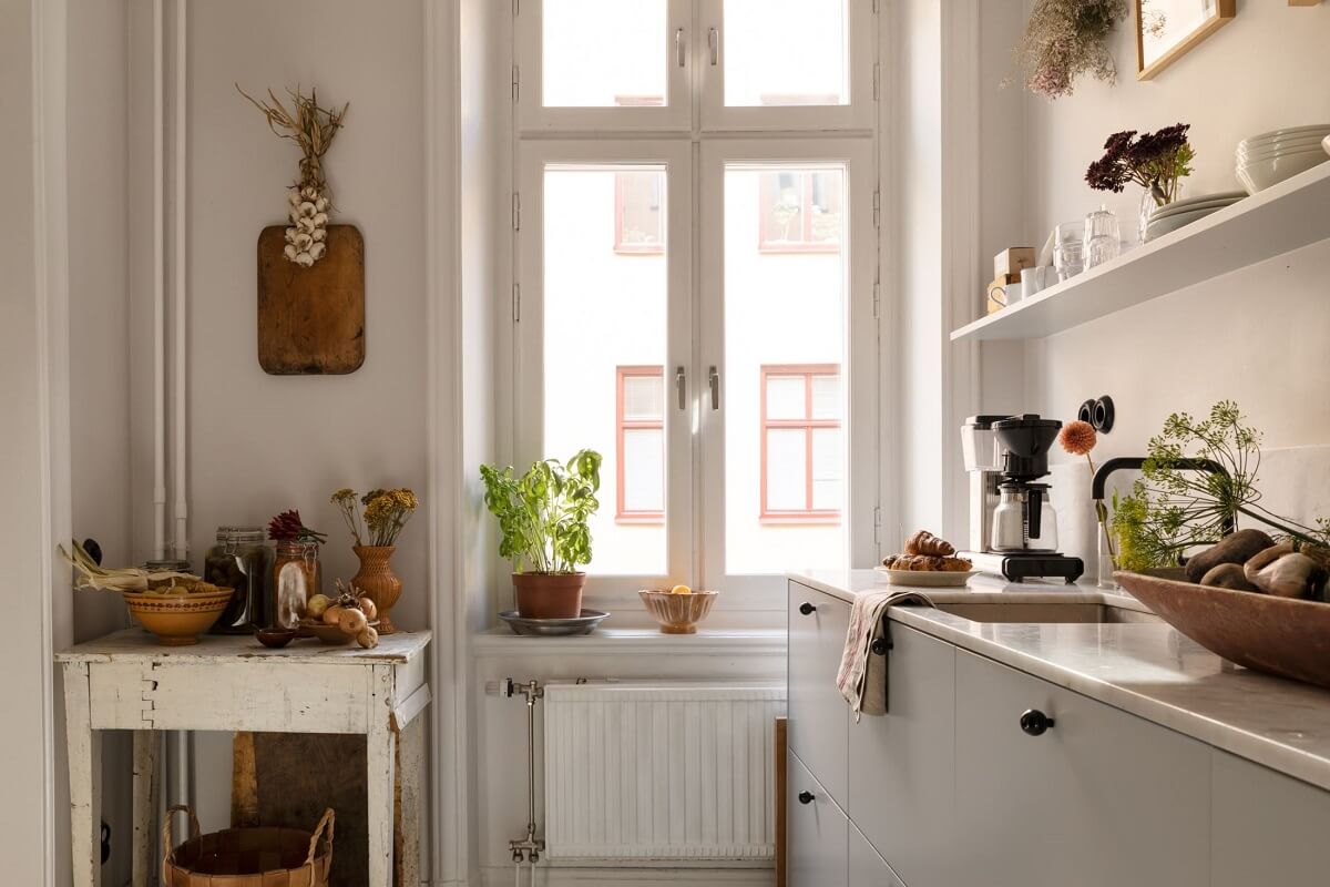 A Bright Scandinavian Apartment with a Light Gray Kitchen 13 kitchen-light-gray-cabinets-window-nordroom