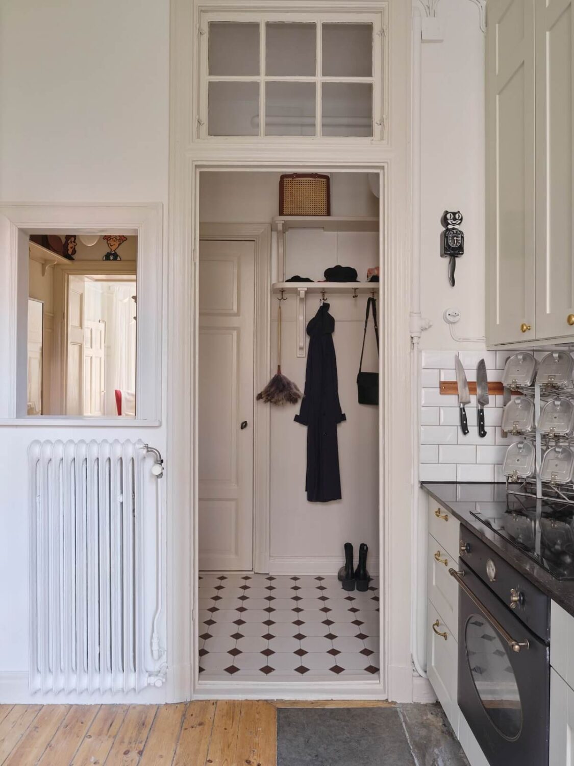 A Light Scandinavian Apartment with Classic Touches 21 kitchen-view-to-hallway