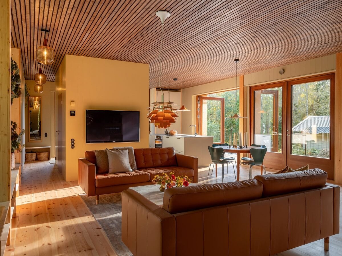 An Architectural Wooden Home with Open Spaces 3 leather-ikea-sofas-wooden-home-nordroom
