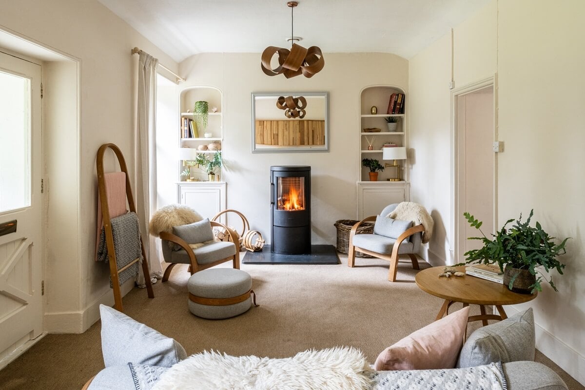 An English Country House That Pairs History with Contemporary Design 10 light-colored-sitting-room-wood-burner-built-in-shelves-nordroom