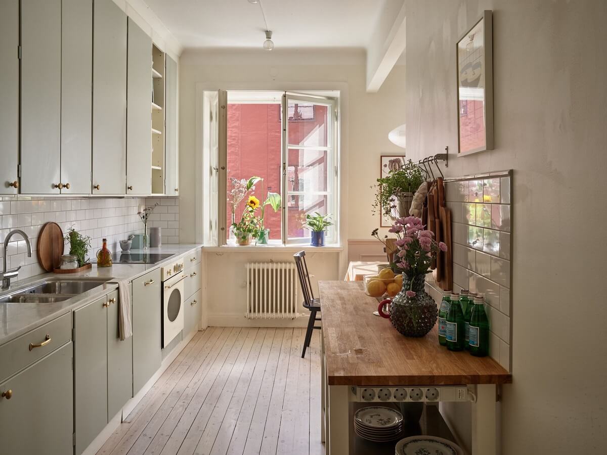 Pastel Colors in a Light Scandinavian Apartment 10 light-gray-kitchen