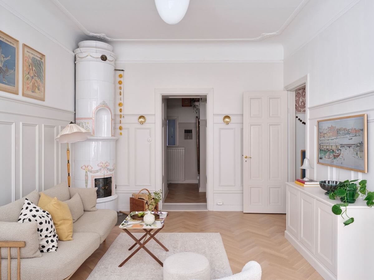 A Light Scandinavian Apartment with Classic Touches 7 light-scandinavian-living-room-fireplace