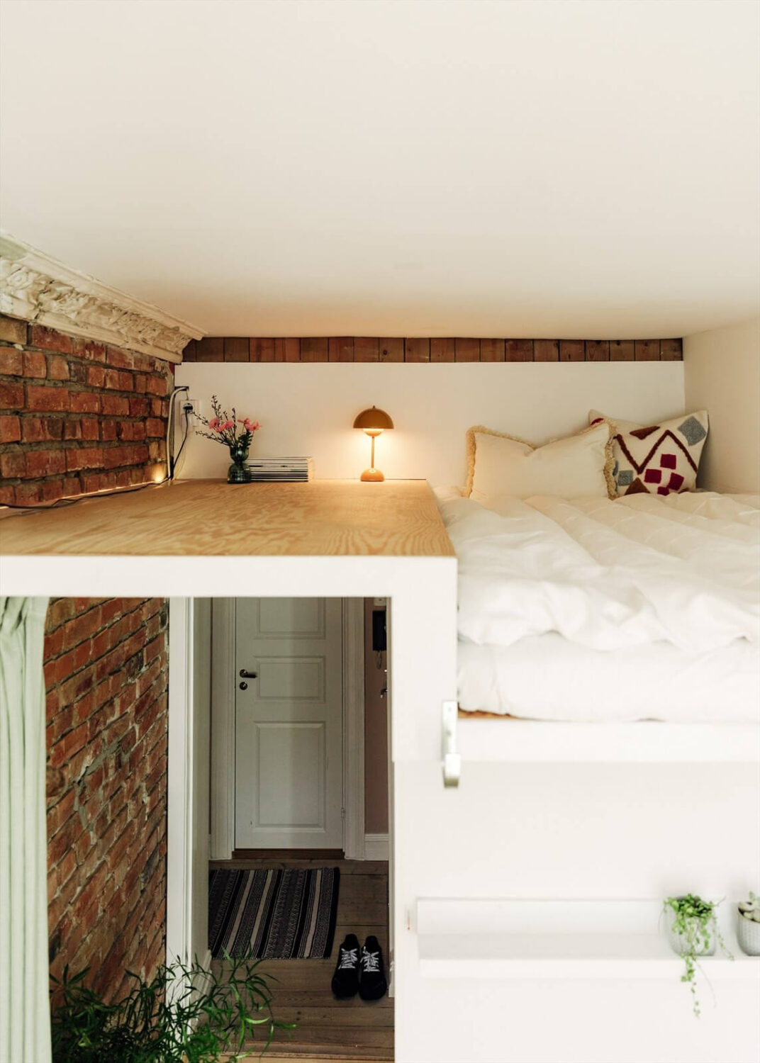 A Charming Norwegian Apartment with Wooden Walls 21 loft-bed-exposed-brick-wall-nordroom