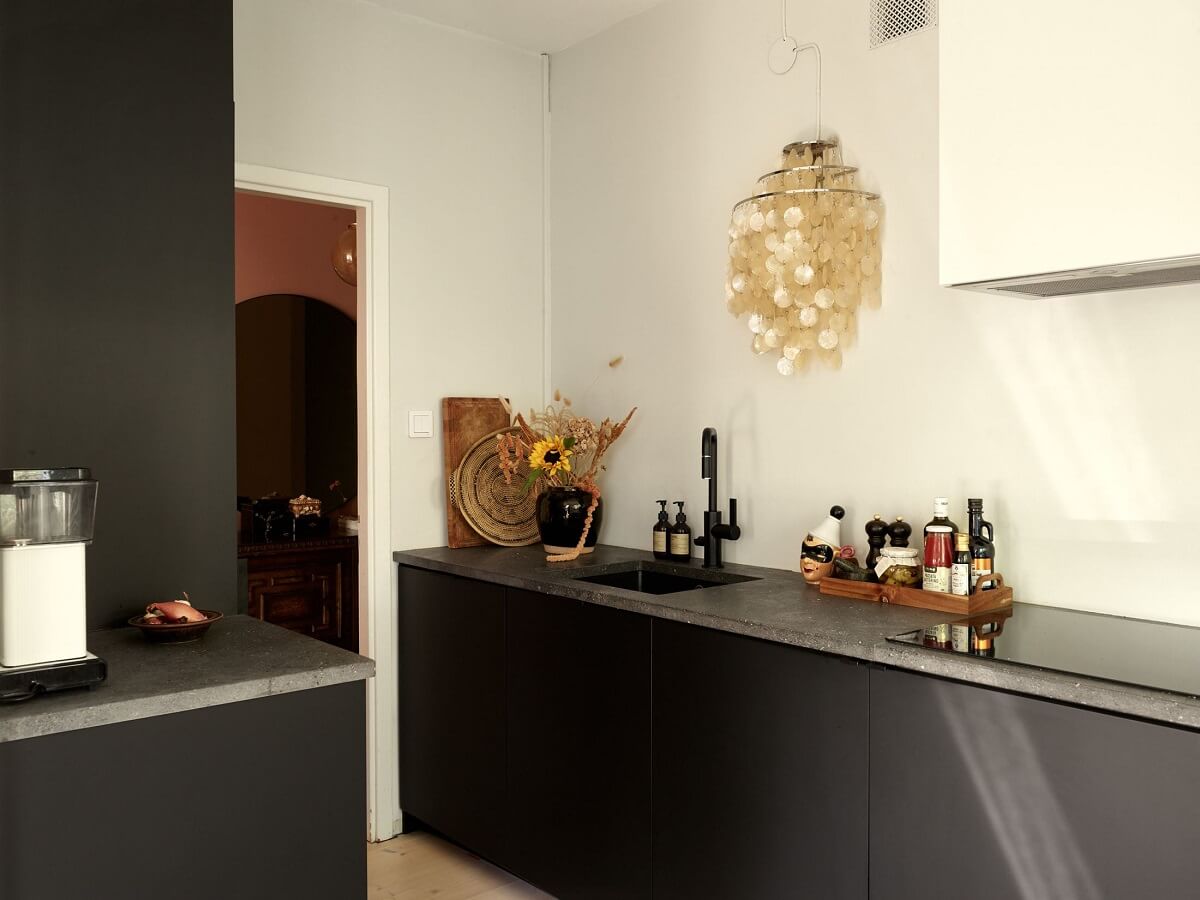 Warm Pink Tones in A Stockholm Apartment 9 modern-black-kitchen-scandinavian-design-nordroom
