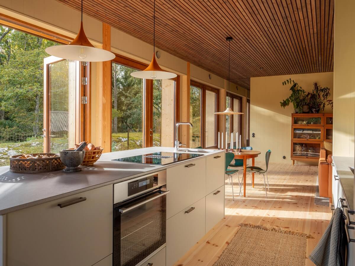 An Architectural Wooden Home with Open Spaces 11 natural-light-open-plan-kitchen-living-room-nordroom