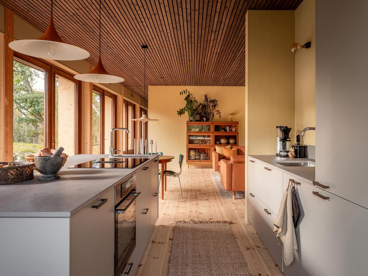 An Architectural Wooden Home with Open Spaces 10 nordic-kitchen-island-wooden-ceiling-nordroom