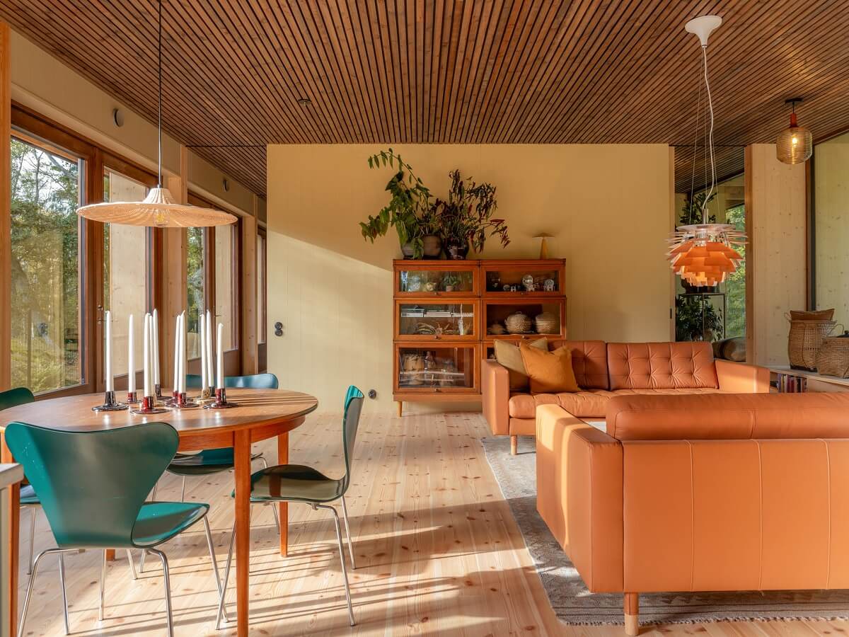 An Architectural Wooden Home with Open Spaces 12 open-plan-living-room-wooden-ceiling-pale-yellow-walls-nordroom