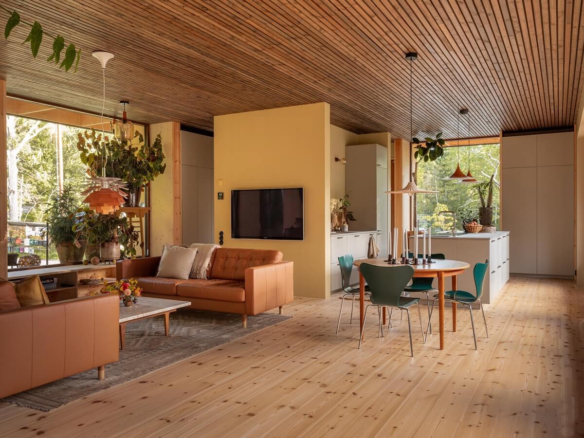 An Architectural Wooden Home with Open Spaces 1 open-plan-scandinavian-house-yellow-accent-wall-nordroom