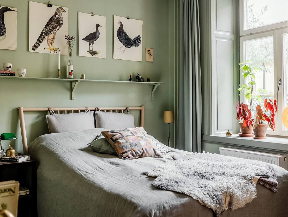 A Vintage Style Apartment in Stockholm 9 pastel-green-bedroom-shelf-above-bed-nordroom