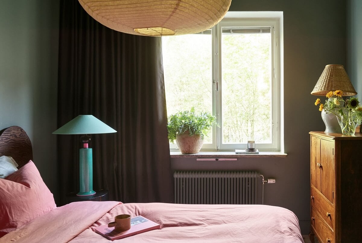 Warm Pink Tones in A Stockholm Apartment 15 pink-bedding-green-walls-bedroom-nordroom