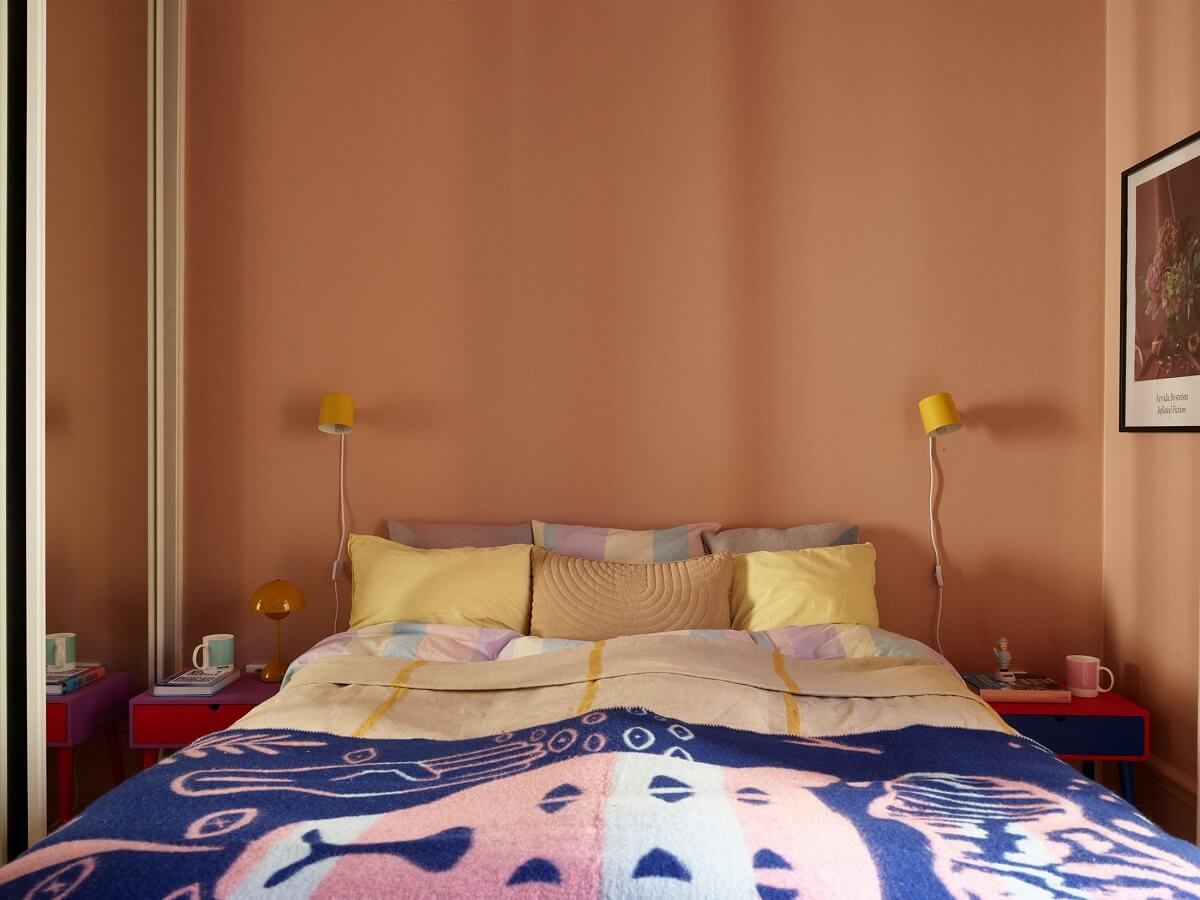 A Small Stockholm Apartment Filled with Color 14 pink-bedroom-yellow-blue-accents-nordroom